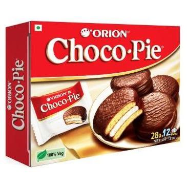 A red box of Twice as Sweet Orion Choco Pie Original (Vietnam) shows chocolate-coated marshmallow pies with a creamy layer, 12 pies (336g), and a 100% Veg label on the front.