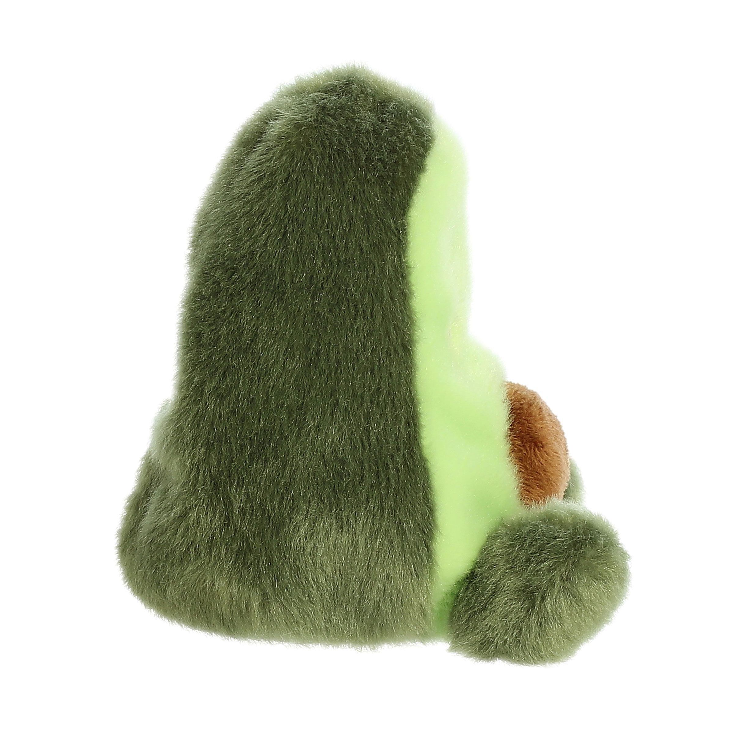 The Twice as Sweet Palm Pal Airy Avacado plush features soft green fabric, a light green face, and a brown pit patch—perfect for foodie plush collectors and shown in a side view.