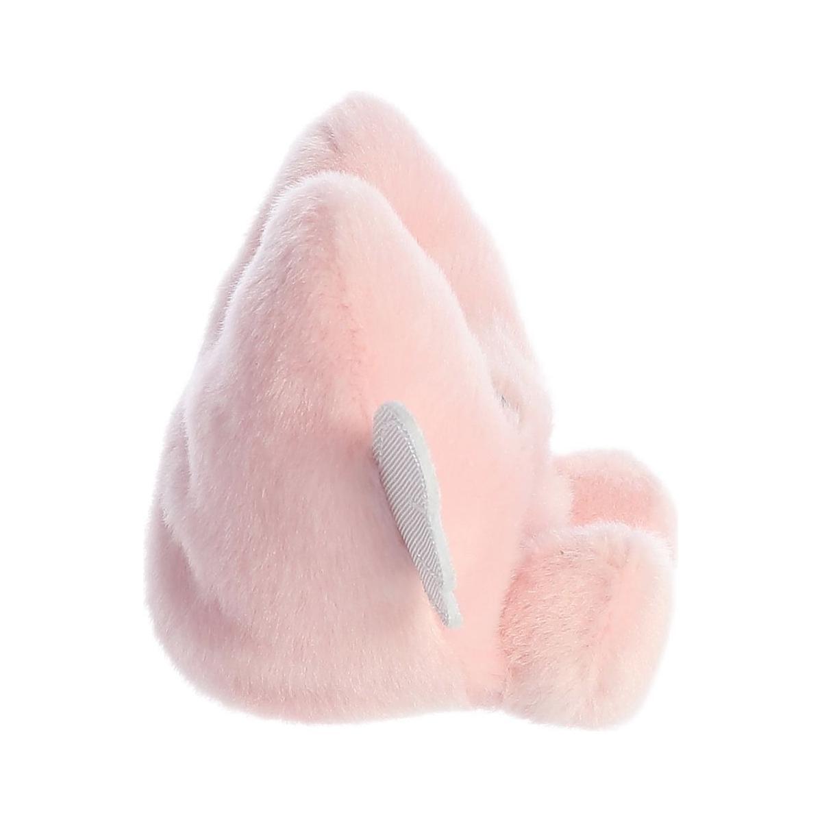 The Palm Pal Bliss Heart by Twice as Sweet is a soft, fluffy, light pink plushie with a small gray wing detail—perfect as a Valentines Day gift.