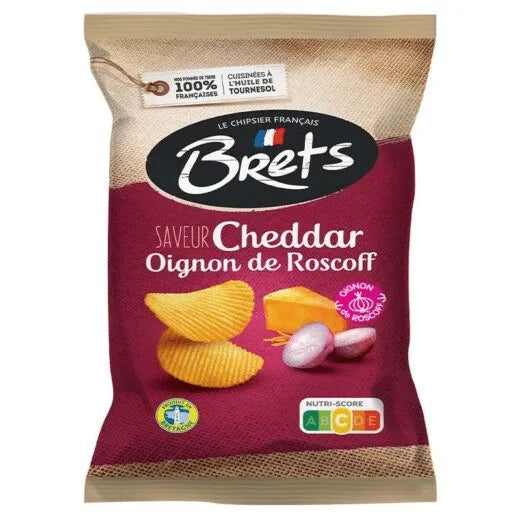 A 125g bag of Twice as Sweet Brets Cheddar and Onion Chips from France, in maroon packaging with crispy chips, cheddar cheese, Roscoff onion, French text, and a visible nutritional score.