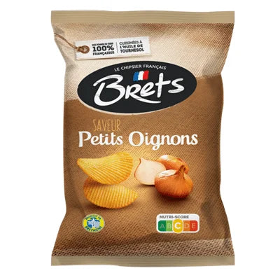 A 125g bag of Twice as Sweet Brets Petits Onions potato chips from France, with ridged French onion flavor, whole onions, a brown design, Nutri-Score label, and French quality symbols highlights this gourmet snack.