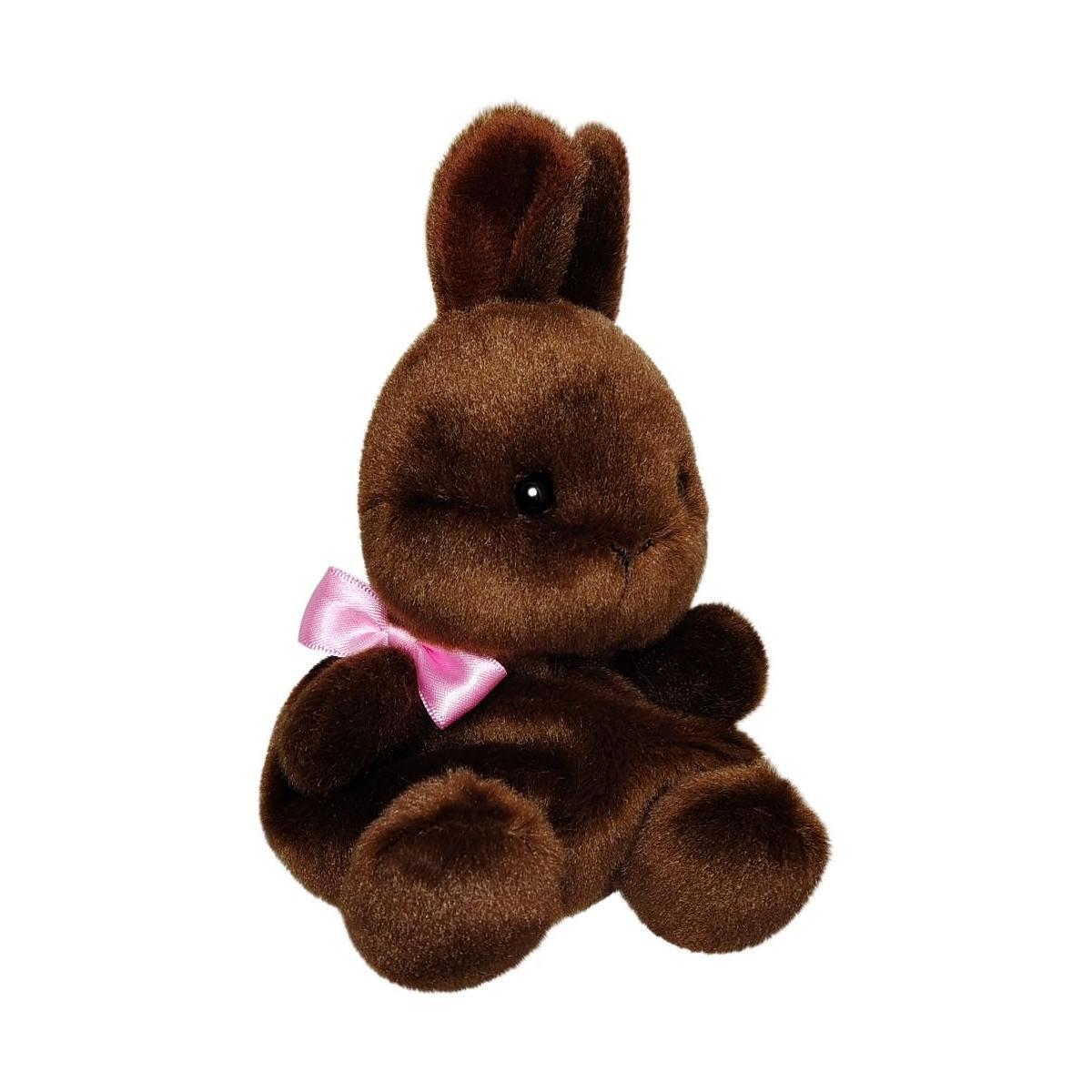 The Twice as Sweet Palm Pal Richie Chocolate Bunny is a plush, chocolate brown bunny with black eyes and a pink satin bow, sitting upright—the perfect seasonal stuffed animal for your collection.