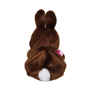 The Twice as Sweet Palm Pal Richie Chocolate Bunny is a plush brown bunny viewed from behind, with upright ears, a white tail, and a pink ribbon visible at the side—an adorable seasonal stuffed animal on a plain white background.