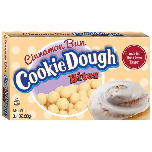 A box of Twice as Sweet Cinnamon Bun Cookie Dough Bites 88g (USA), featuring cookie dough bites and a frosted cinnamon bun on the light brown, white polka-dotted box with red and blue lettering.