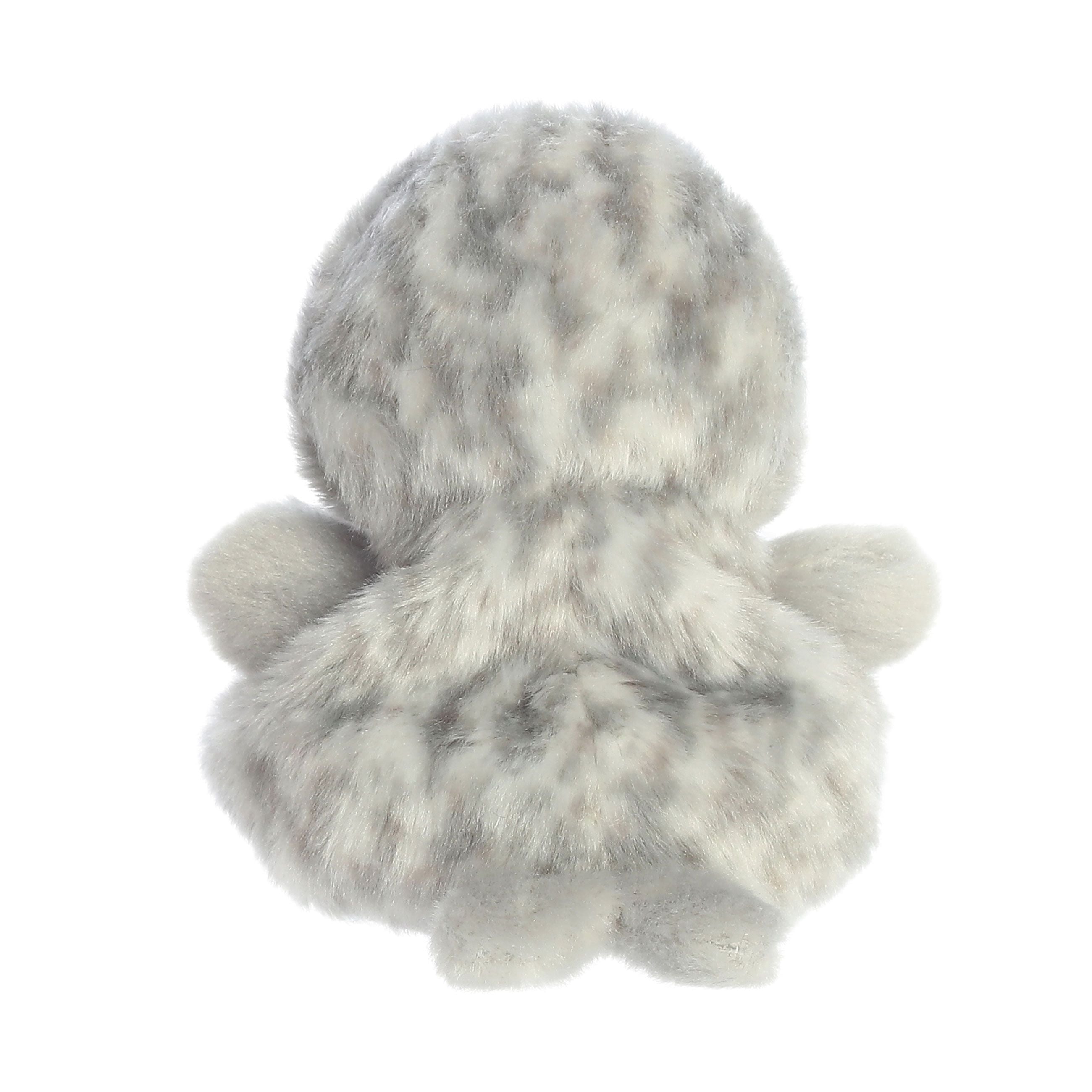 The Twice as Sweet Palm Pal Marina Harbour Seal is a palm-sized, fluffy gray and white plushie with small arms and legs, shown from the back against a white background. It features a soft, furry texture and an animal fur pattern.