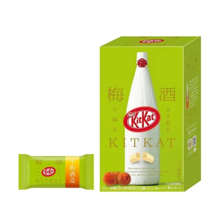 The Twice as Sweet KitKat Ume Sake 9 Piece Box (Japan) comes in green and yellow packaging with a sake bottle and plum design. Includes individually wrapped bars—a unique treat for fans of sake and Japanese plum chocolate.