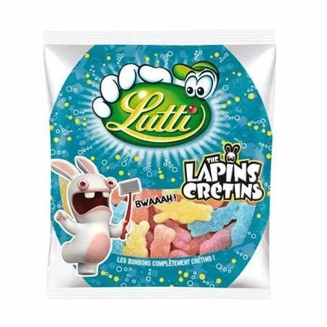 A colorful 225g bag of Twice as Sweet Lutti Lapins Cretins fruit gummies from France, featuring cartoon rabbits and tasty candies visible through a window on the front of the packaging.