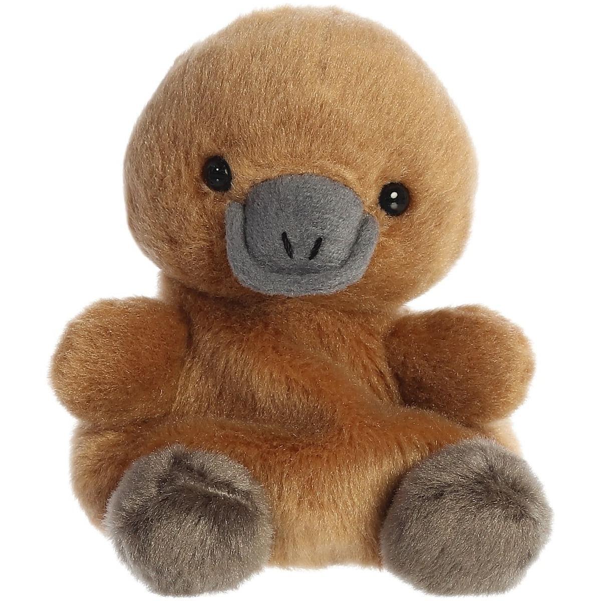 The Twice as Sweet Palm Pal Patty Platypus is a soft brown plush with a gray bill, round black eyes, and gray feet. This charming forest animal sits upright against a white background—perfect for all ages.