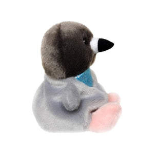 The Twice as Sweet Palm Pal Crumbs Pigeon is a plush toy pigeon with soft gray fur, a dark gray head, black beak, and pink feet, sitting upright with a shiny blue ribbon—perfect for city plush collections. Shown on a white background.