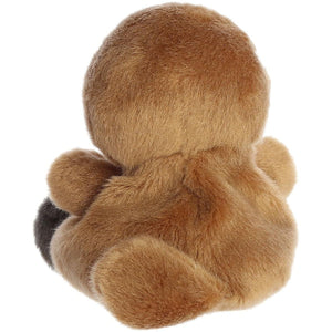 The Palm Pal Patty Platypus by Twice as Sweet is a brown, plush stuffed animal sitting with its back to the camera, showing its soft, fuzzy fur and rounded head, body, and limbs while its face and front remain hidden.