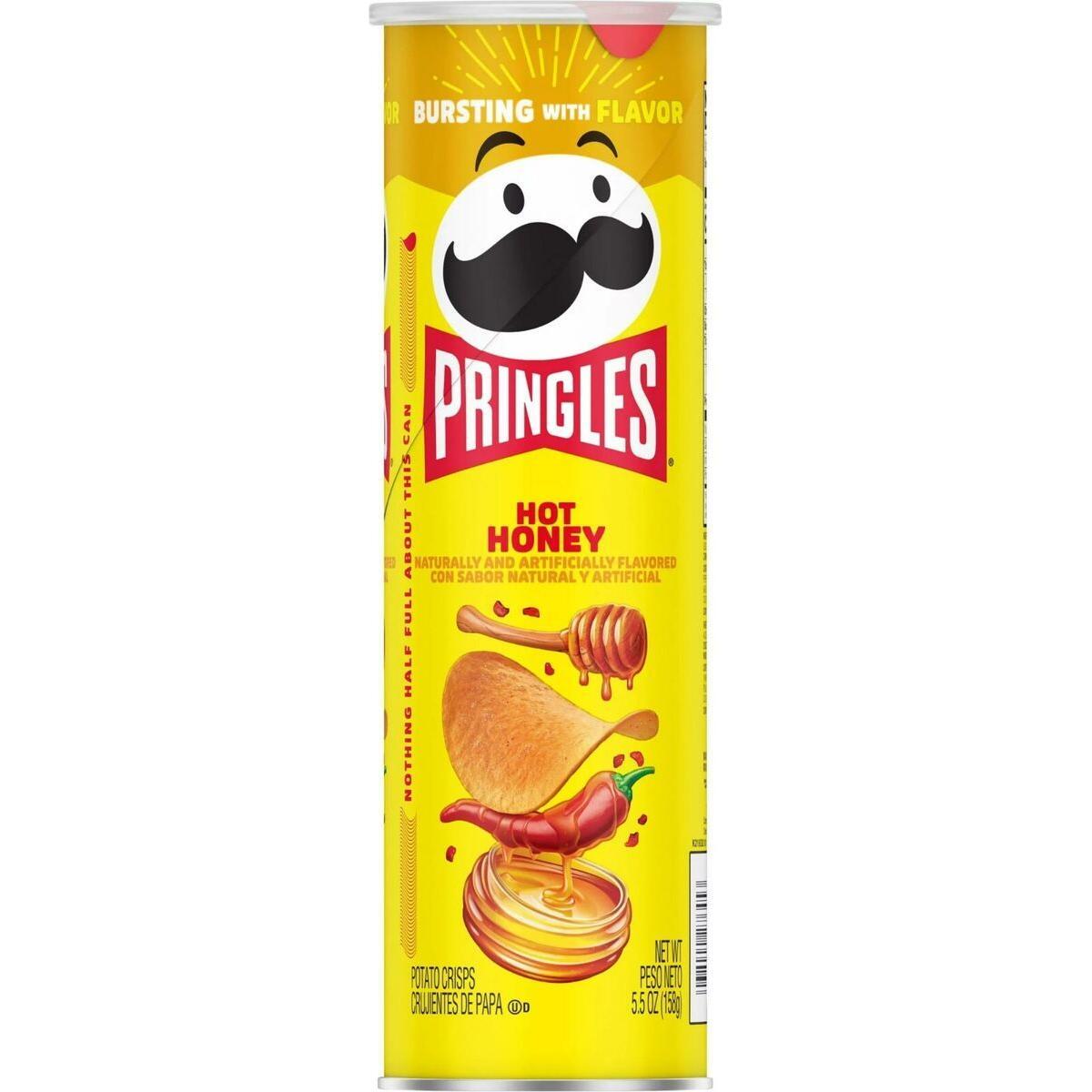 A yellow Twice as Sweet Pringles Hot Honey 158g (USA) can features the classic mustached logo, spicy potato crisps, honey dipper, honey, and red chili peppers—ideal for fans of honey chilli snacks.