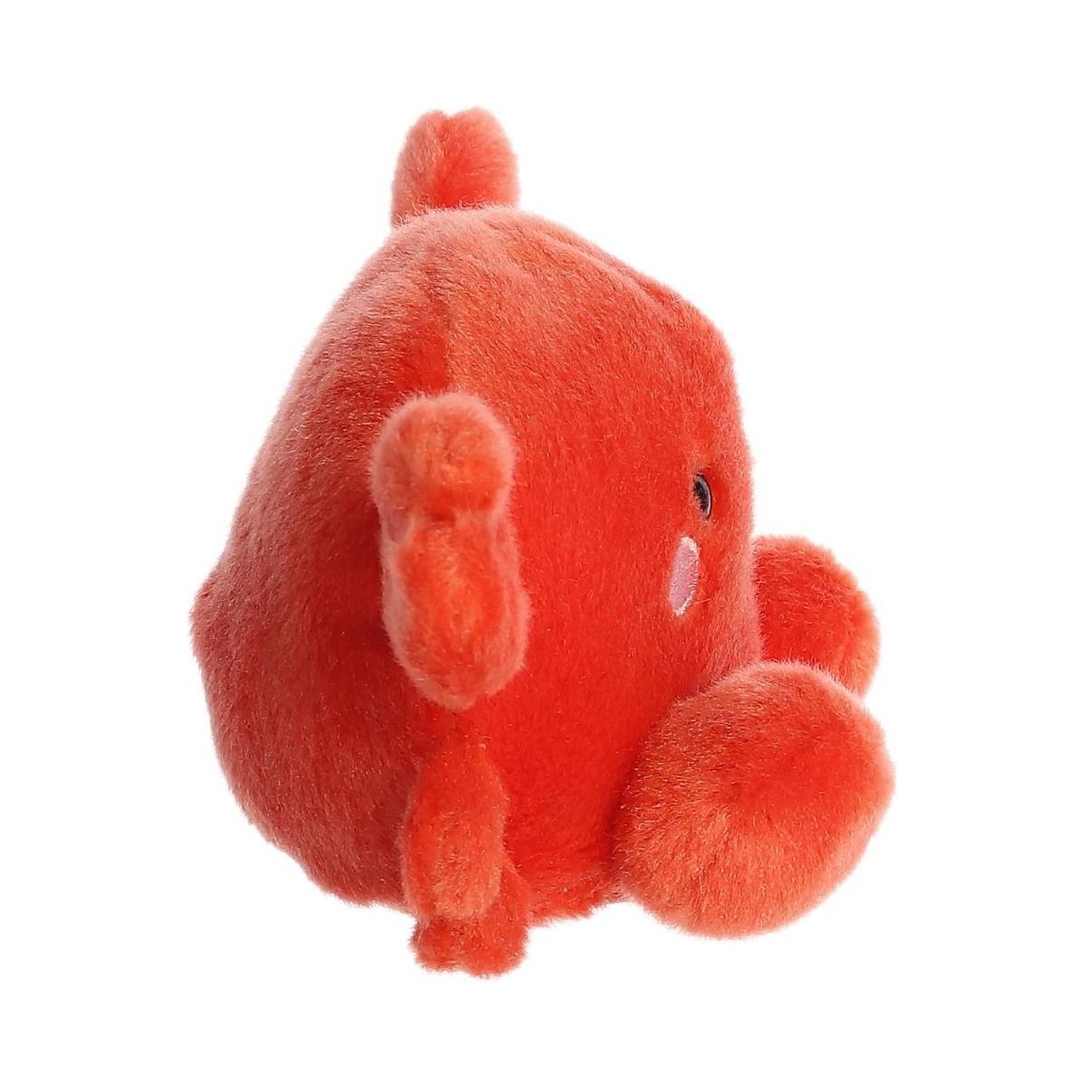 The Twice as Sweet Palm Pal Snippy Crab plush, a round orange-red crab with small claws and legs, sits upright on a plain white background—perfect for an aquatic party theme.