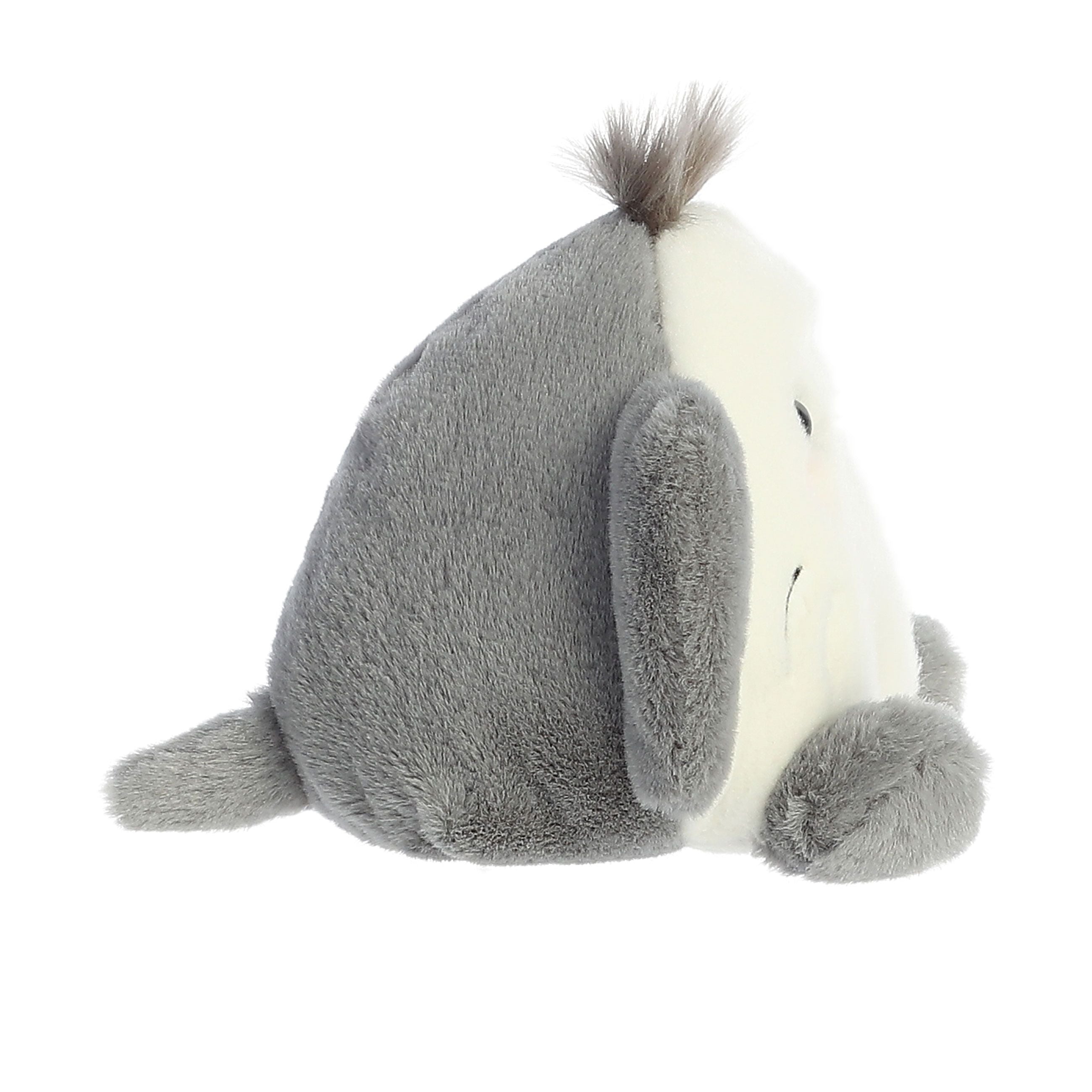 The Twice as Sweet Palm Pal Flapjack Stingray is a grey and white plush toy with floppy fins, a round body, and a tuft of hair on its head—this charming aquatic stuffed animal makes a unique addition to any collection.