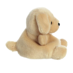 The Twice as Sweet Palm Pal Sunny Lab is a soft, light brown plush puppy with floppy ears, black button eyes, and a black nose. It sits upright facing right, with a small tail, against a plain white background.