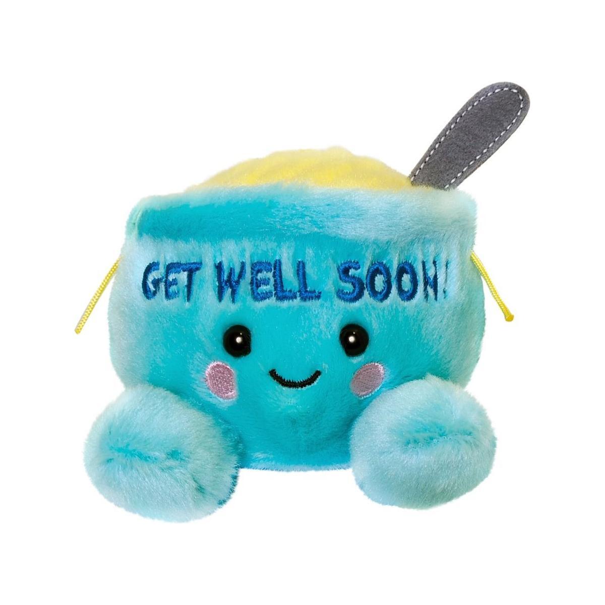 The Twice as Sweet Palm Pal Welly Chicken Soup is a blue bowl-shaped plush with a gray spoon, smiling face, pink cheeks, and GET WELL SOON! embroidery—perfect for cheering up anyone who needs warmth and comfort.